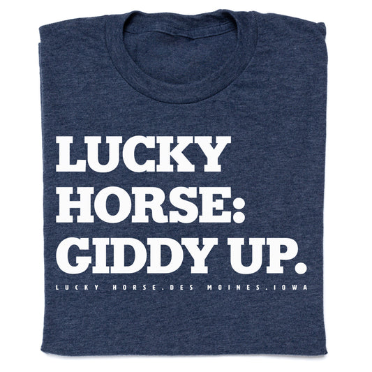 Dark blue RAYGUN t-shirt featuring the white text LUCKY HORSE: GIDDY UP., with LUCKY HORSE. DES MOINES. IOWA printed in smaller text below.