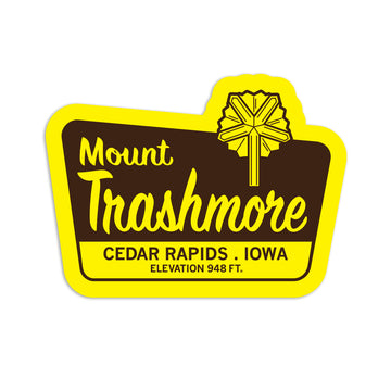 A yellow and brown Mount Trashmore vinyl sticker from Cedar Rapids, Iowa, featuring a sunburst icon above the text and the site’s elevation of 948 ft.