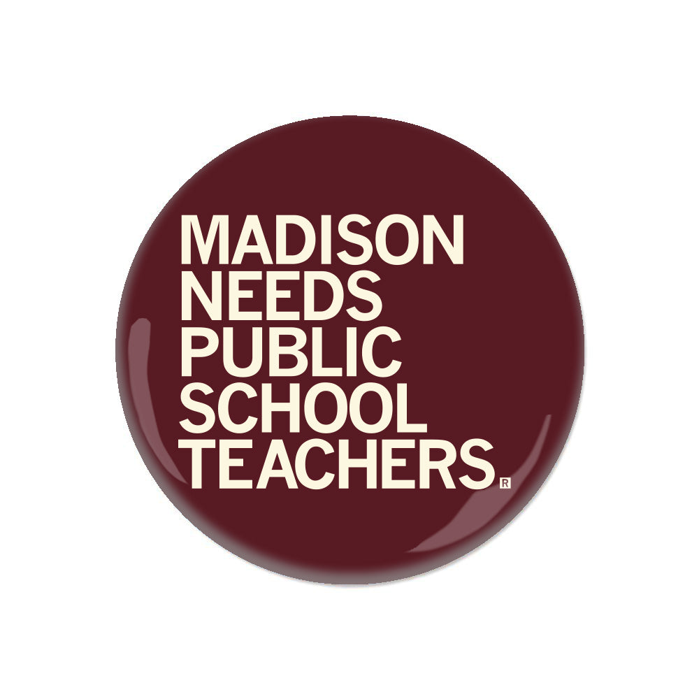 A circular maroon RAYGUN button with white text that reads, MADISON NEEDS PUBLIC SCHOOL TEACHERS.