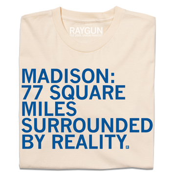 Cream-colored Madison t-shirt featuring blue text that reads: MADISON: 77 SQUARE MILES SURROUNDED BY REALITY.