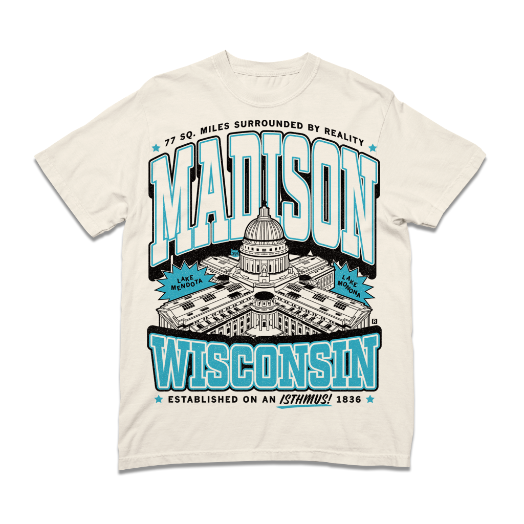 Off-white, garment-dyed heavyweight t-shirt featuring a graphic of the Wisconsin State Capitol with the text Madison, Wisconsin, and 77 sq. miles surrounded by reality.