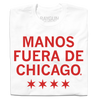A white t-shirt with scarlet red ink that says, "Manos fuera de Chicago" over four red stars, like the Chicago flag.