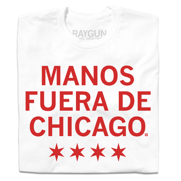 A white t-shirt with scarlet red ink that says, "Manos fuera de Chicago" over four red stars, like the Chicago flag.