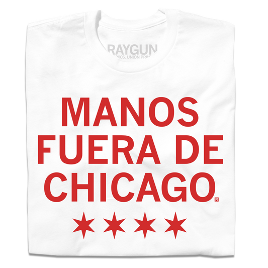 A white t-shirt with scarlet red ink that says, "Manos fuera de Chicago" over four red stars, like the Chicago flag.