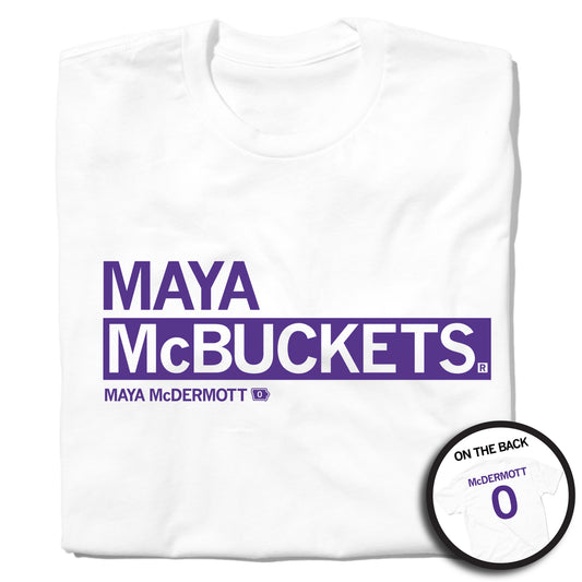 White t-shirt with the text MAYA McBUCKETS and MAYA McDERMOTT 0 in deep purple, with an inset showing the back of the shirt featuring McDERMOTT 0.