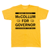 A heather mellow yellow t-shirt with black ink text that reads "Benny Buckets. McCollum for Governor. A Governor for ball."