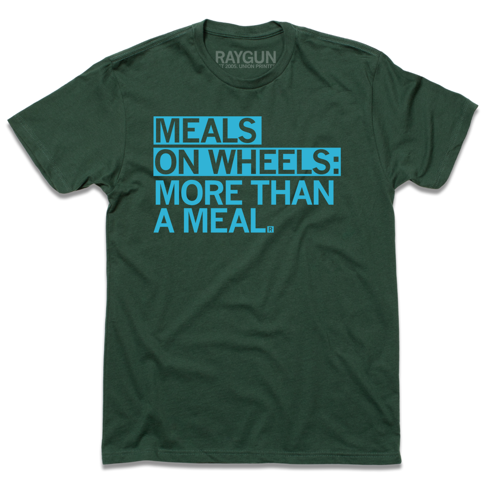 Short sleeve dark green t-shirt with bright blue print text that says, "Meals On Wheels: More than a meal"