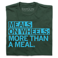 A folded forest green t-shirt with left-aligned bright blue text that reads "Meals On Wheels: More than a meal" in all caps.