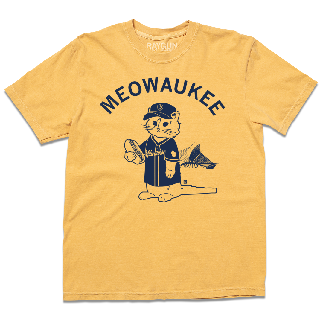 Comfort Colors mustard yellow t-shirt with navy ink that says, "MEOWAUKEE" in curved text over Gary The Cat wearing Brewers gear while holding a hotdog.