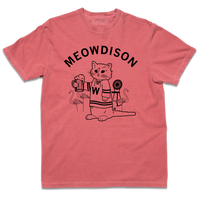 Comfort Colors heavyweight red t-shirt with black ink. Curved text at the top says, "Meowdison" above an illustration of a cat holding a pint of beer while wearing a hockey jersey. There are lawn flamingos and a rocking chair in the background.