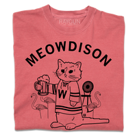 A folded heavyweight red t-shirt with black ink. Curved text at the top says, "Meowdison" above an illustration of a cat holding a pint of beer while wearing a hockey jersey. There are lawn flamingos and a rocking chair in the background.