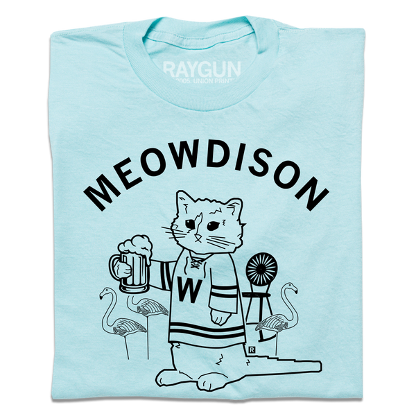 A folded pastel blue t-shirt with black ink. Curved text at the top says, 
