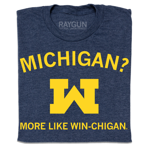 A folded heather denim shirt with gold ink that reads 