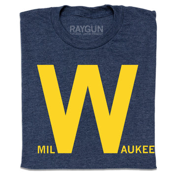 Folded heather navy t-shirt with yellow text that says, "milWaukee" with just the W in huge font.