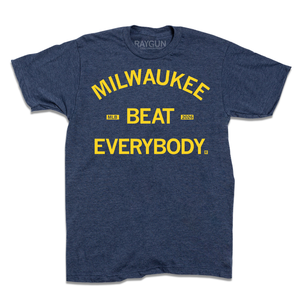 A short sleeve heather denim t-shirt with centered yellow text that reads "Milwaukee Beat Everybody."