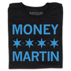 A folded black t-shirt with bright blue ink that says, "MONEY MARTIN" with four Chicago flag stars in the middle and small "20"s printed between them.