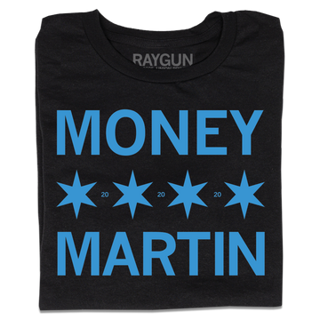 A folded black t-shirt with bright blue ink that says, "MONEY MARTIN" with four Chicago flag stars in the middle and small "20"s printed between them.