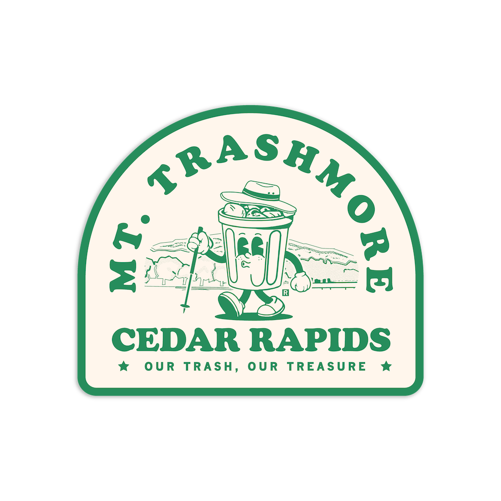 A cartoon trash can wearing a bucket hat and holding a hiking pole on a Mt. Trashmore vinyl sticker, with text reading Mt. Trashmore Cedar Rapids, Our Trash, Our Treasure.