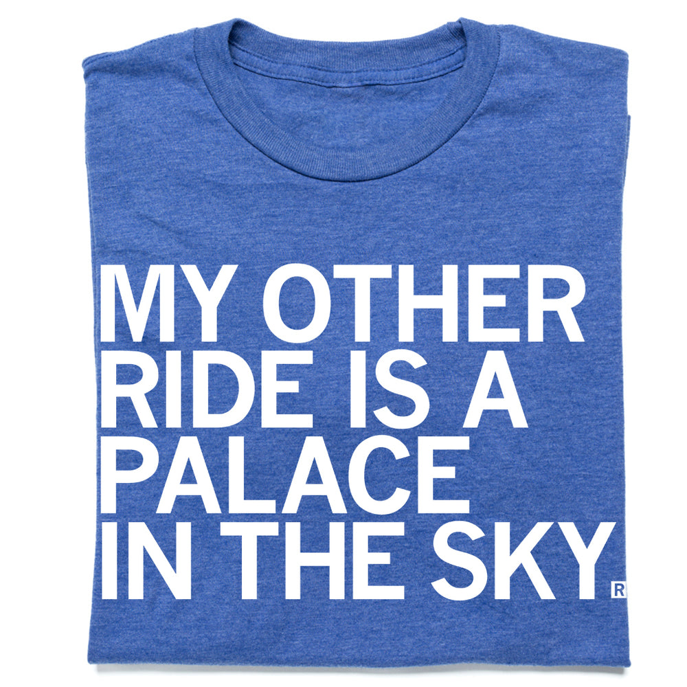 Blue t-shirt with the text "My Other Ride is a Palace in the Sky" in white ink