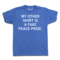 A heather blue tee with centered white ink print that reads "My Other Shirt is a Fake Peace Prize"