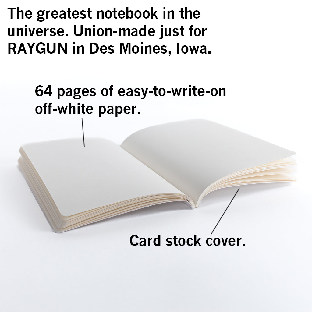 An open union-printed notebook with 64 pages of off-white paper and a card stock cover, featuring text identifying it as a union-made RAYGUN product from Des Moines, Iowa.