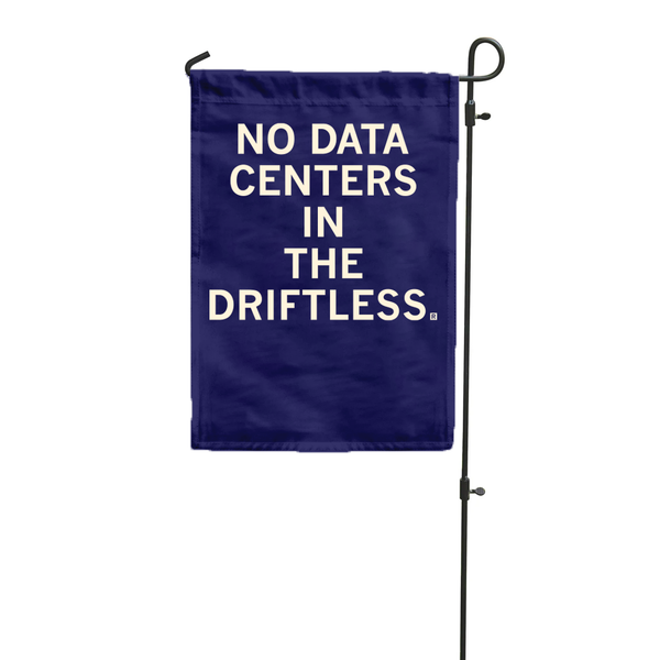 A dark blue garden flag hanging vertically from a flag pole with white ink text that says, 