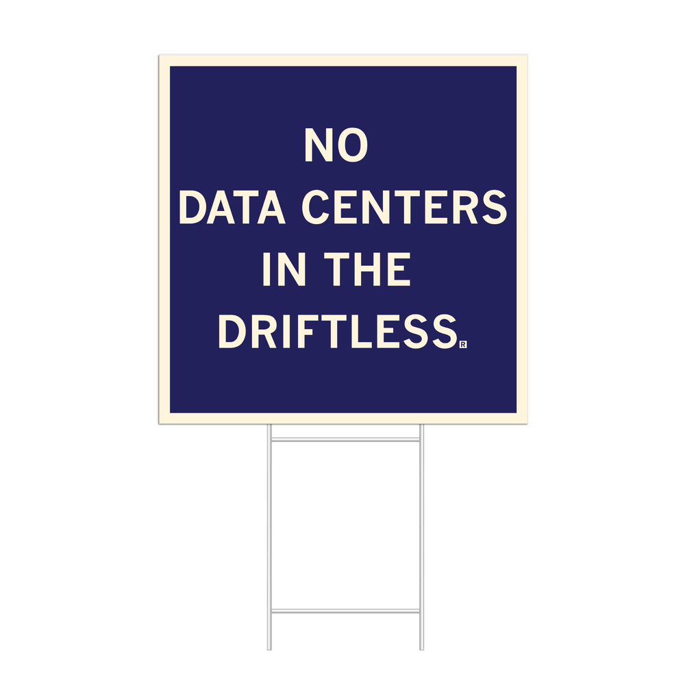 A dark blue square yard sign with off-white border and text that reads "No data centers in The Driftless."