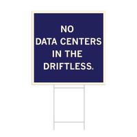 A dark blue square yard sign with off-white border and text that reads "No data centers in The Driftless."