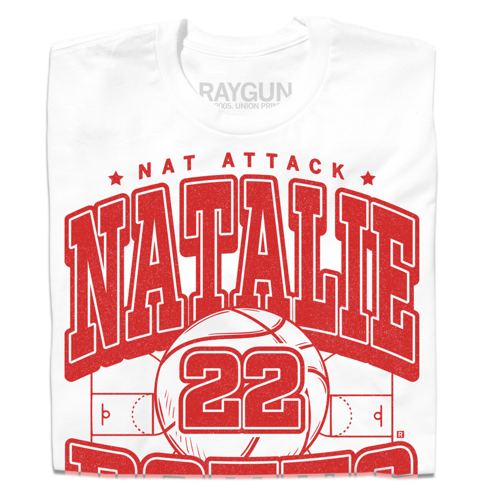 White t-shirt with bright red ink that says, "Nat Attack" in small font above "Natallie Potts 22" in large text." At the bottom it reads "St. Louis MO * Forward" and all of the text is above a volleyball court.
