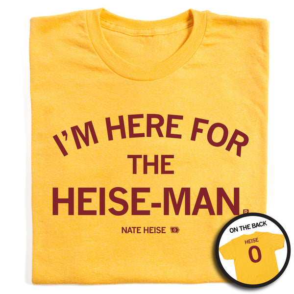 A folded heather yellow t-shirt with cardinal ink that reads 