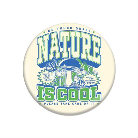 A round RAYGUN metal button that reads GO TOUCH GRASS, NATURE, IS COOL, and PLEASE TAKE CARE OF IT, featuring illustrations of a mushroom, a frog, a butterfly, and text bubbles noting that insects, plants, fungi, and amphibians are cool.