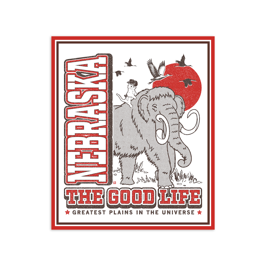 Die-cut vinyl Nebraska sticker featuring a woolly mammoth with a cowboy cat on its back, a red sun, birds, and the text Nebraska: The Good Life, Greatest Plains in the Universe.
