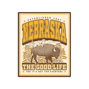 Die-cut vinyl Nebraska sticker featuring a cat riding a bison, with the title NEBRASKA ESTABLISHED 1867 and the text THE GOOD LIFE and TBH ITS NOT FOR EVERYONE at the bottom.