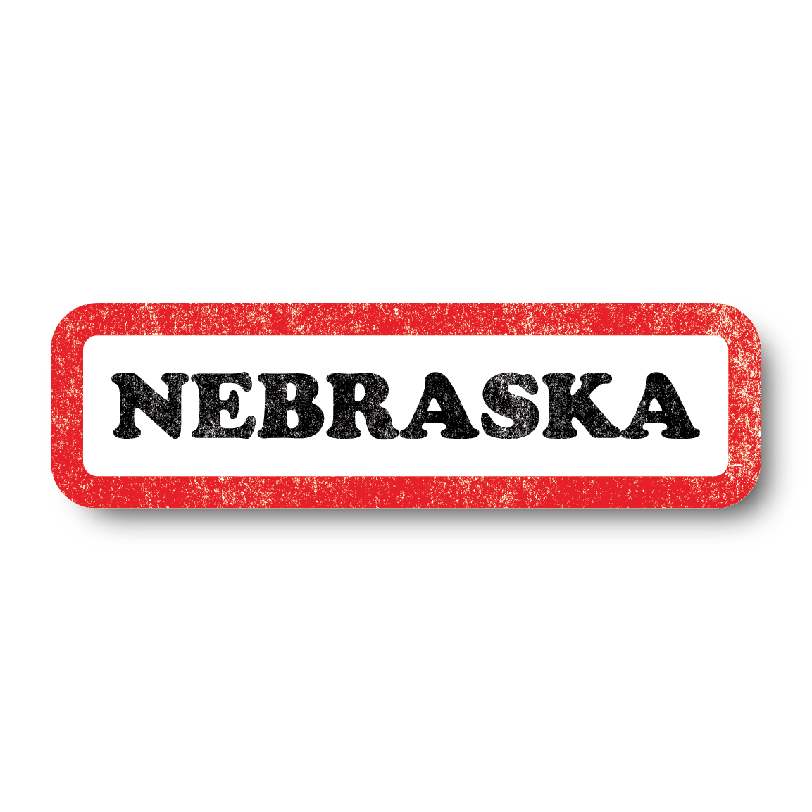 A vintage style white rectangle sticker with a faded red border and faded black text that says, "NEBRASKA"