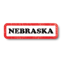 A vintage style white rectangle sticker with a faded red border and faded black text that says, "NEBRASKA"