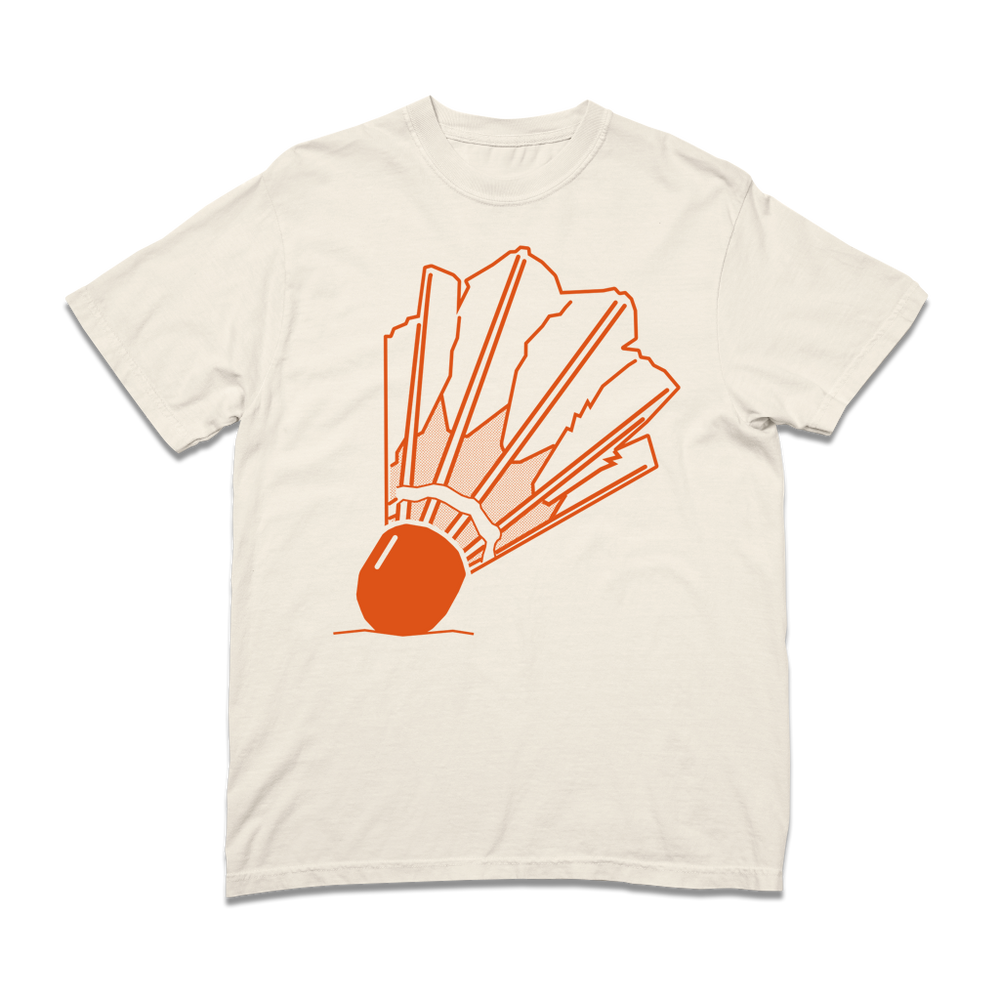 An off white t-shirt with orange ink depicting a giant badminton shuttlecock on the front and the text "Nelson Atkins Museum of Art" on the back.