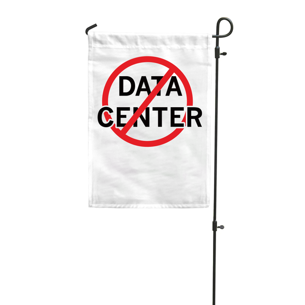 A white garden flag hanging vertically from a flag pole that has 