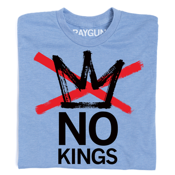 A heather light blue shirt with a blank ink crown and red ink X through it. Text below says, "NO KINGS"