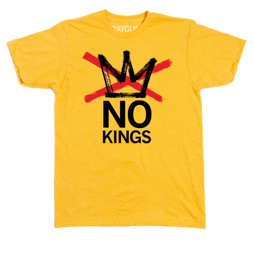 A heather mellow yellow t-shirt with a red ink X going across a black crown with black text below that says, "NO KINGS"
