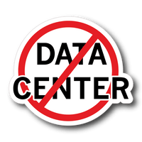 A circular sticker or decal featuring the text 'DATA CENTER' in bold black letters on a white background, crossed out by a red prohibition symbol with a black outline, shown on a muted blue-gray background.