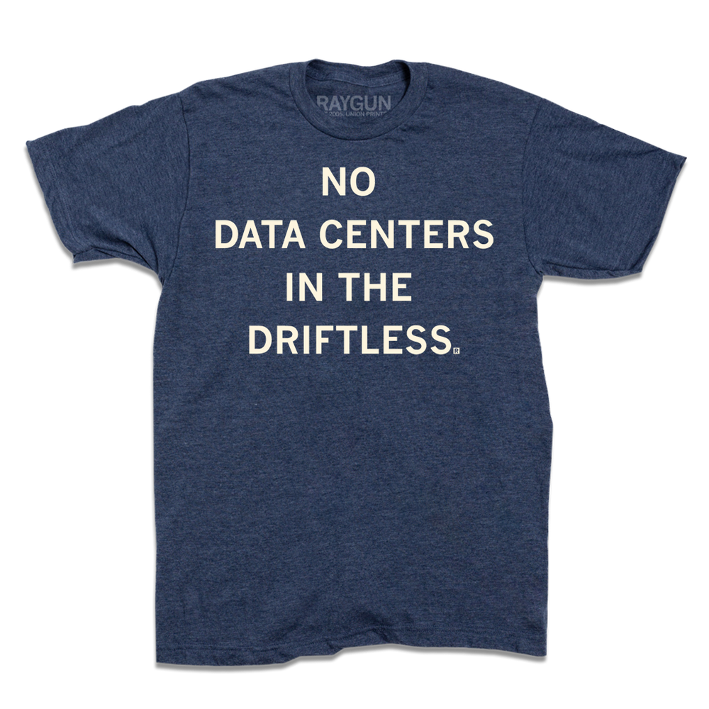 A short-sleeve heather denim t-shirt with centered cream ink that reads "No Data Centers In The Driftless"