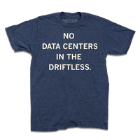 A short-sleeve heather denim t-shirt with centered cream ink that reads "No Data Centers In The Driftless"