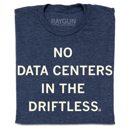 A folded heather navy t-shirt with centered cream ink that reads "No Data Centers In The Driftless"