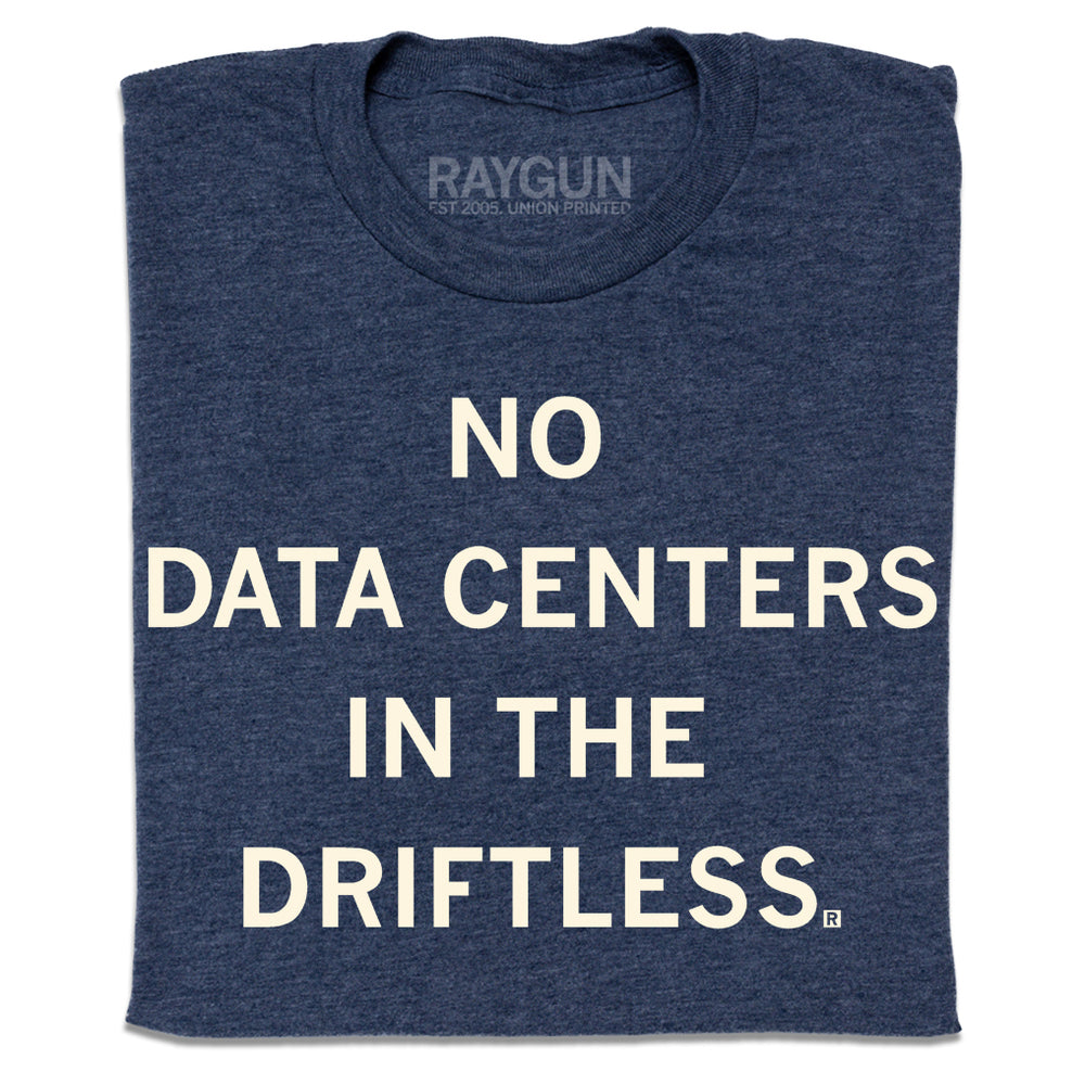 A folded heather navy t-shirt with centered cream ink that reads "No Data Centers In The Driftless"