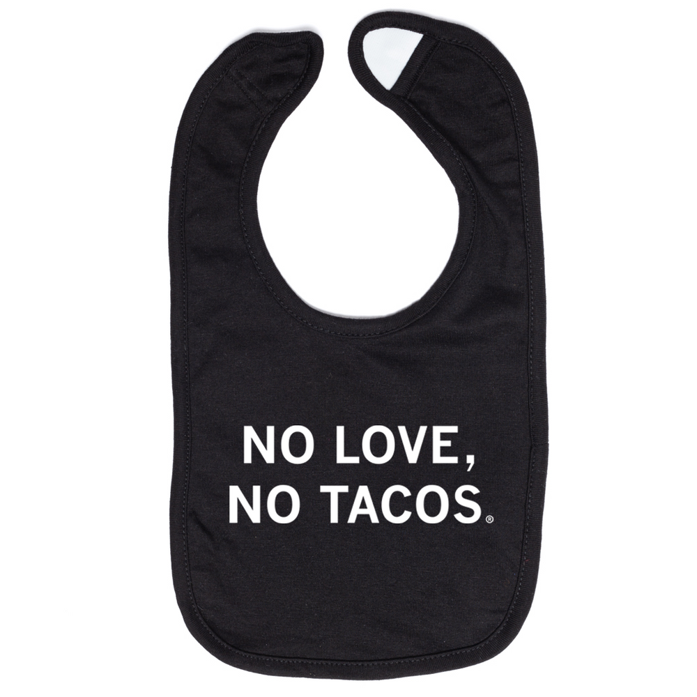 A black baby bib with centered white text that reads "No Love, No Tacos."