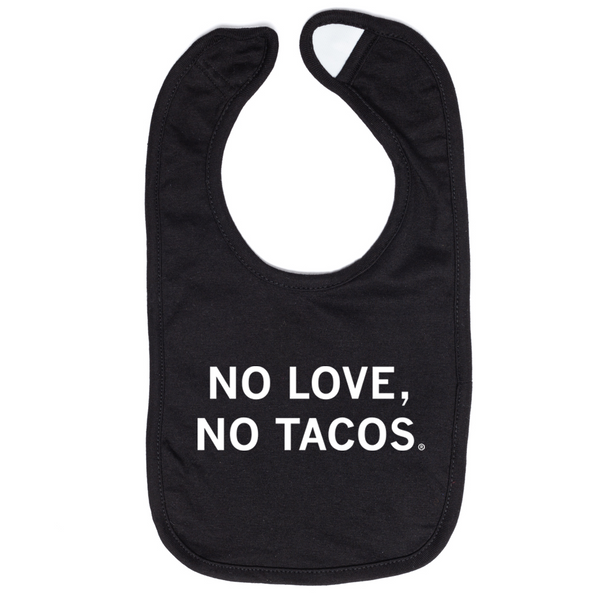 A black baby bib with centered white text that reads 