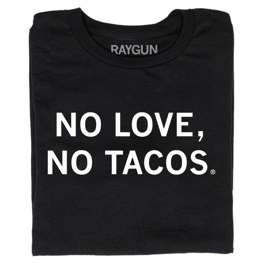 A folded black t-shirt with centered white text that reads "No Love, No Tacos."