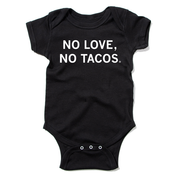 Black baby onesie with centered white text that reads 