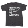 Charcoal gray RAYGUN T-shirt with the white text NEBRASKA: HONESTLY, ITS NOT FOR EVERYONE.