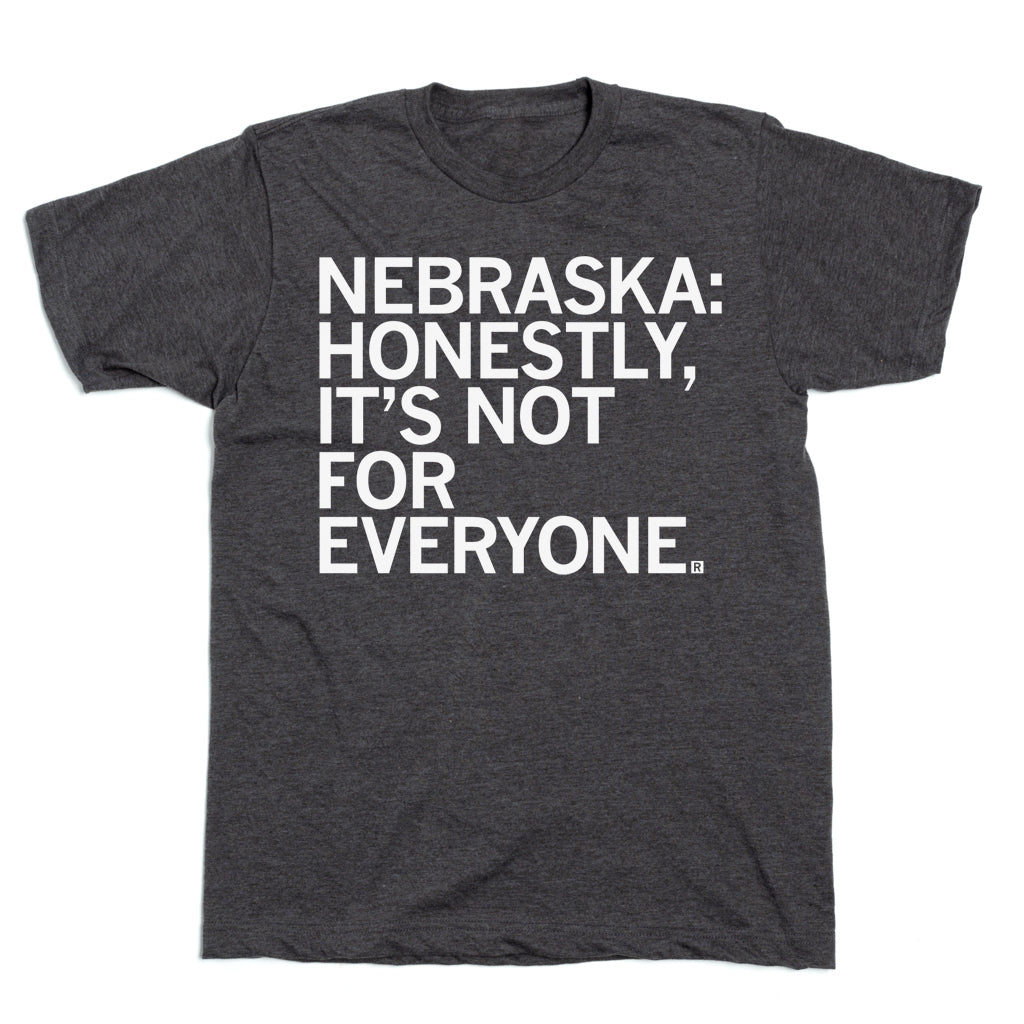 Charcoal gray RAYGUN T-shirt with the white text NEBRASKA: HONESTLY, ITS NOT FOR EVERYONE.